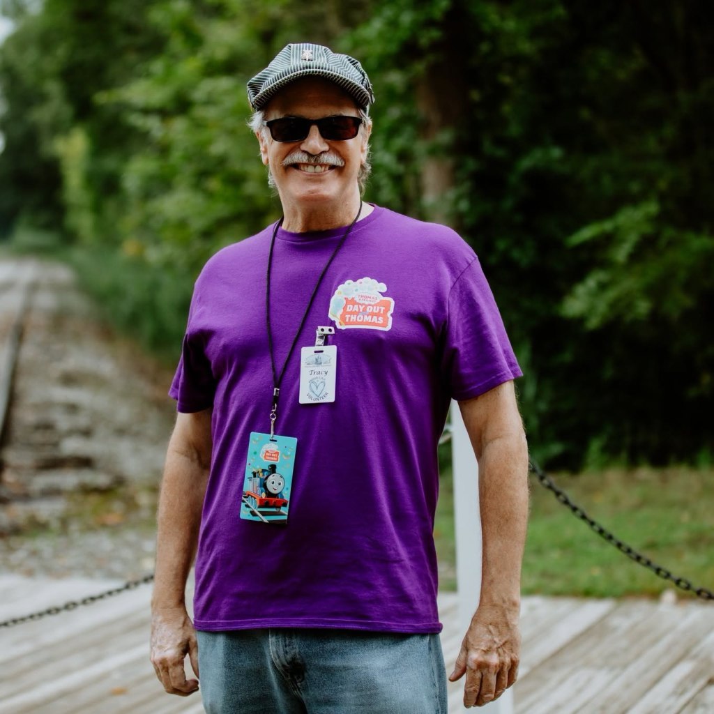 Photo of a man who is volunteering at Crossroads Village.
